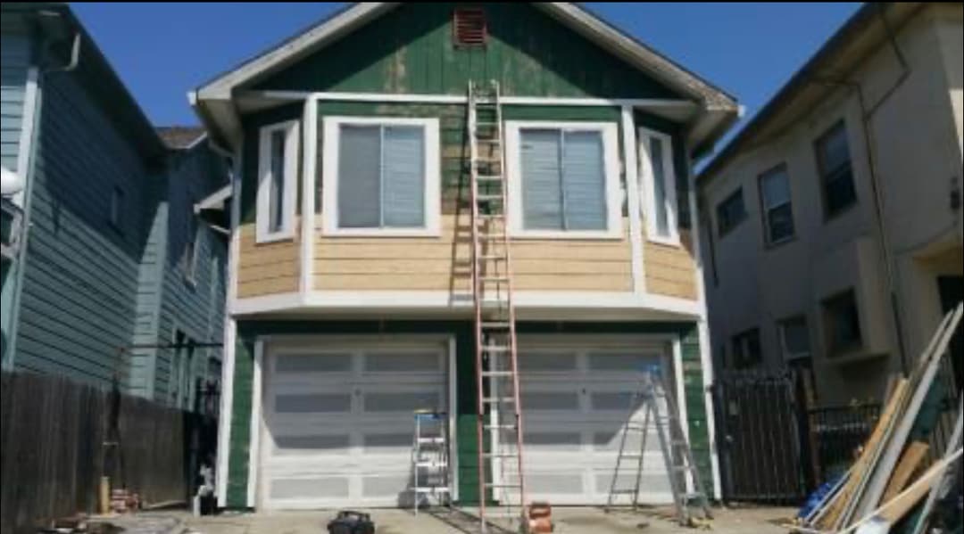 green home in need of a paint job