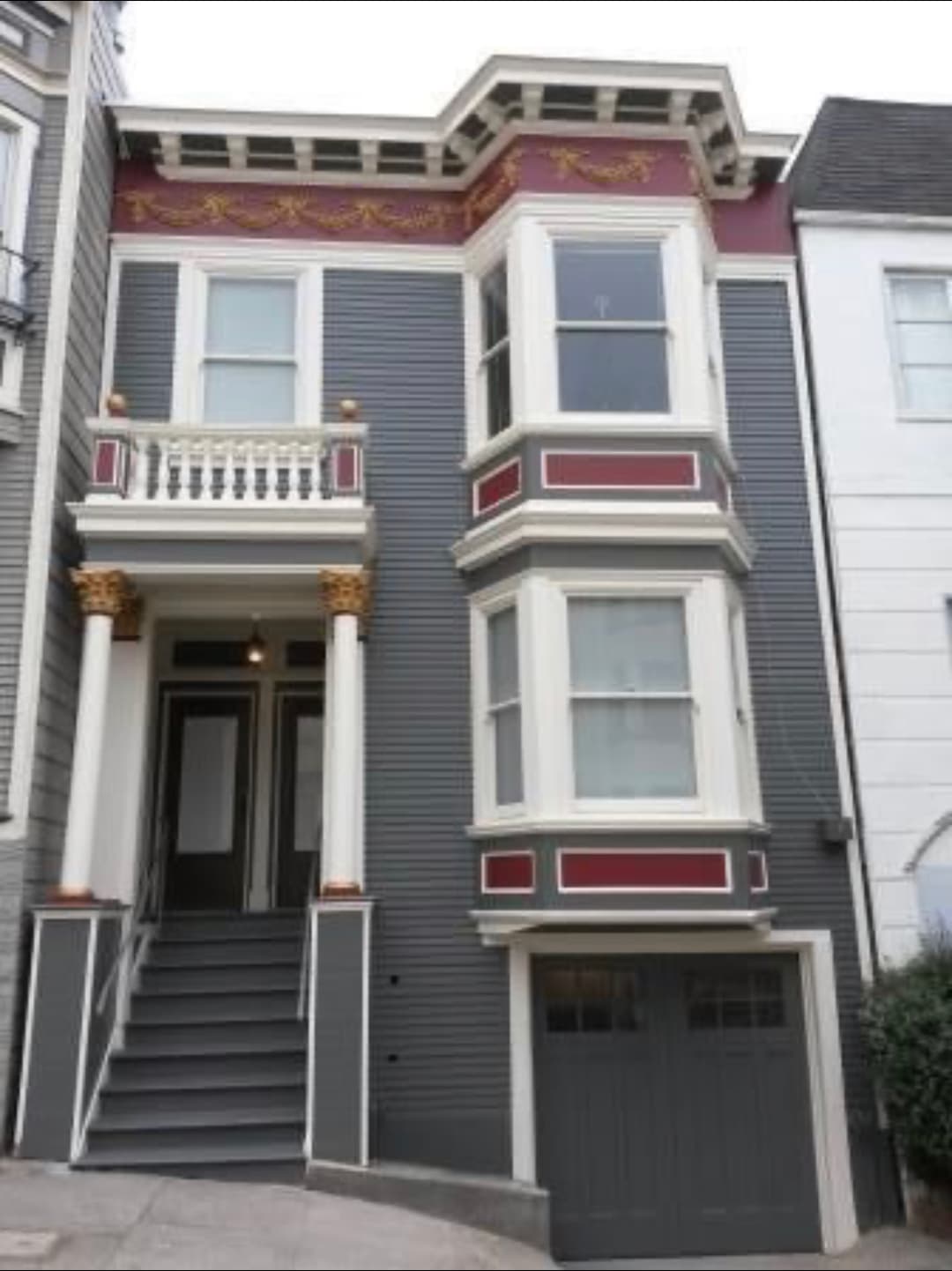 Freshly painted after picture of victorian style home