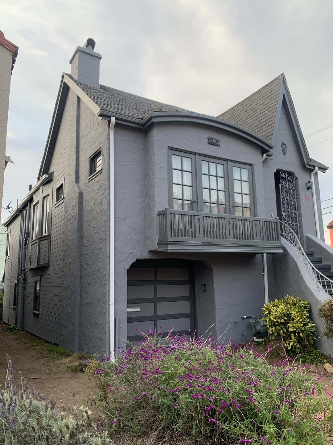 new gray textured stucco on home