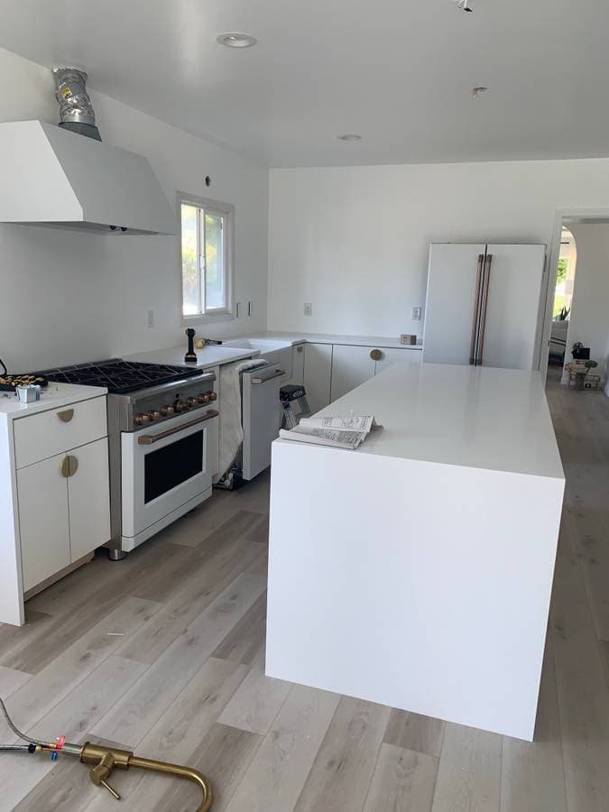 remodeled kitchen with laminate flooring and new kitchen countertops