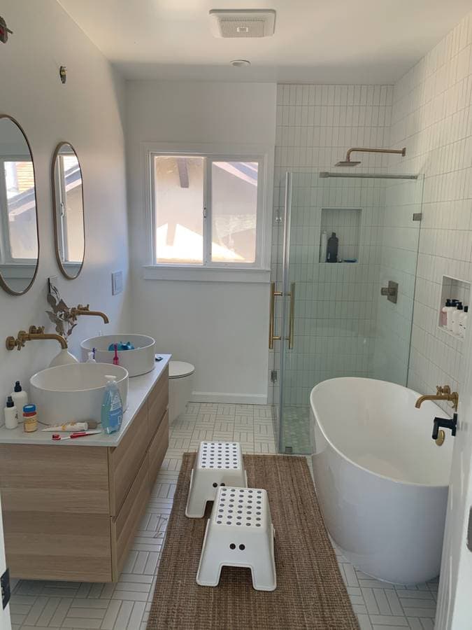 Remodeled bathroom with new luxury bathtub and new luxury kitchen sinks